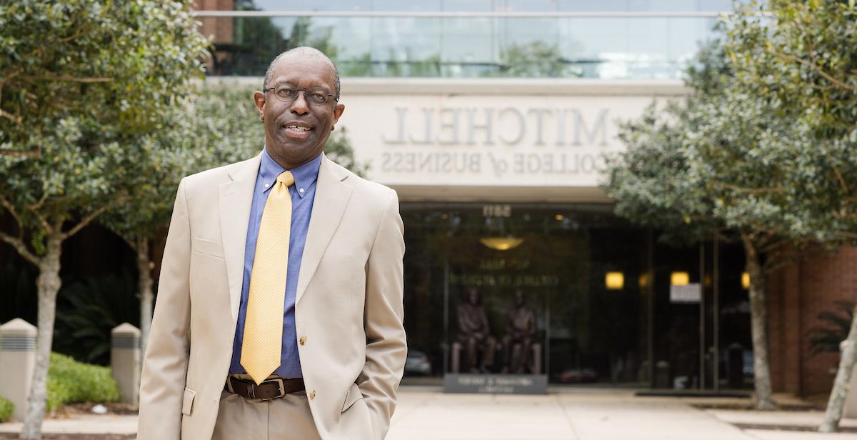 Dr. Alvin Willams, interim dean of the Mitchell College of Business, stands in front of the college. 
